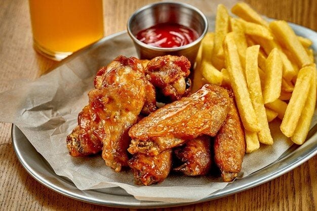 Wings 6 Pieces with Fries and Soda.